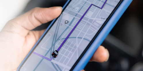 Hand holding phone with map