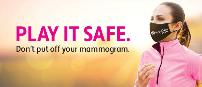 Masked woman in pink jacket